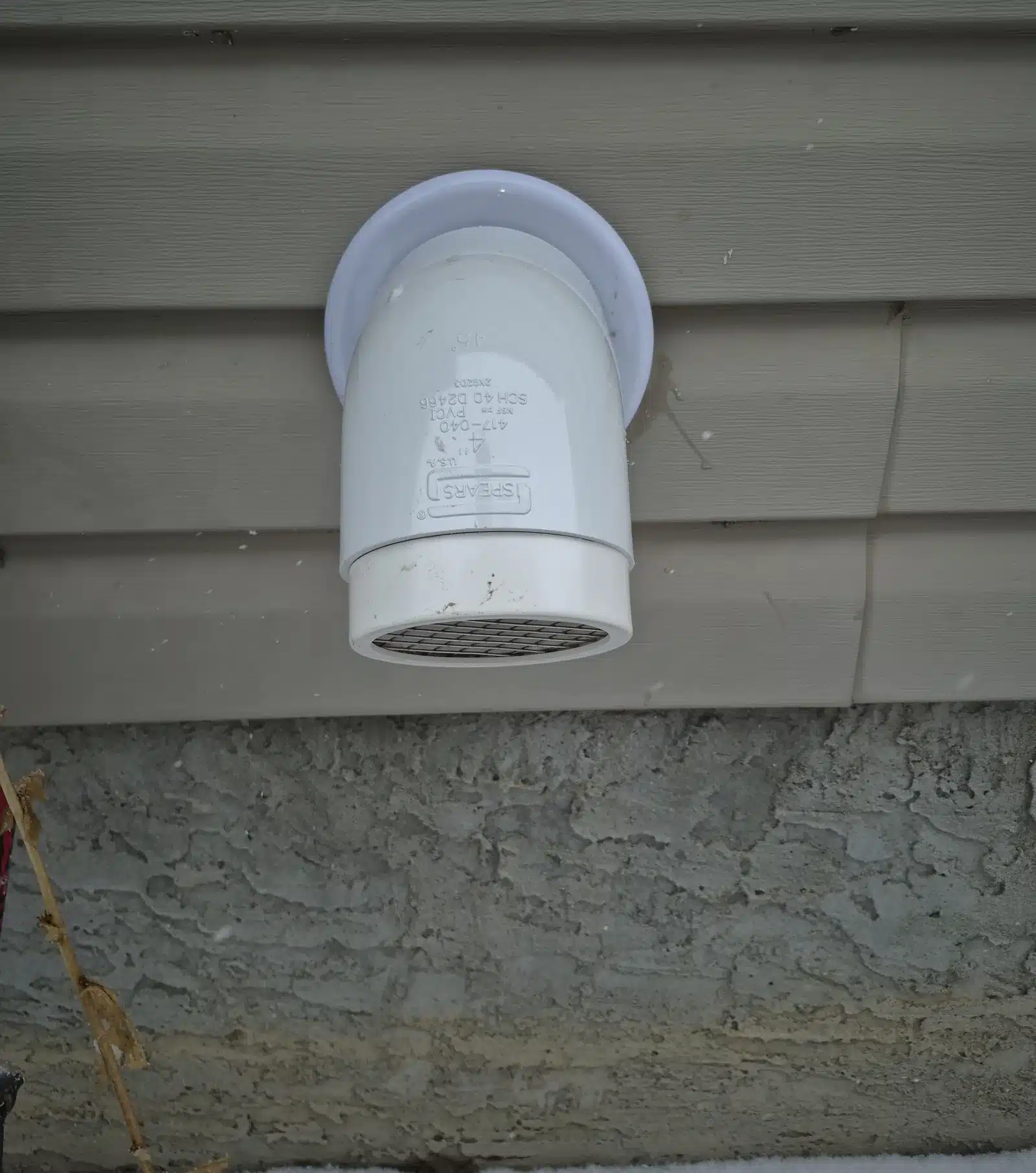 Screened Radon Vent On The Side Wall Of A Southwest Airdrie Home