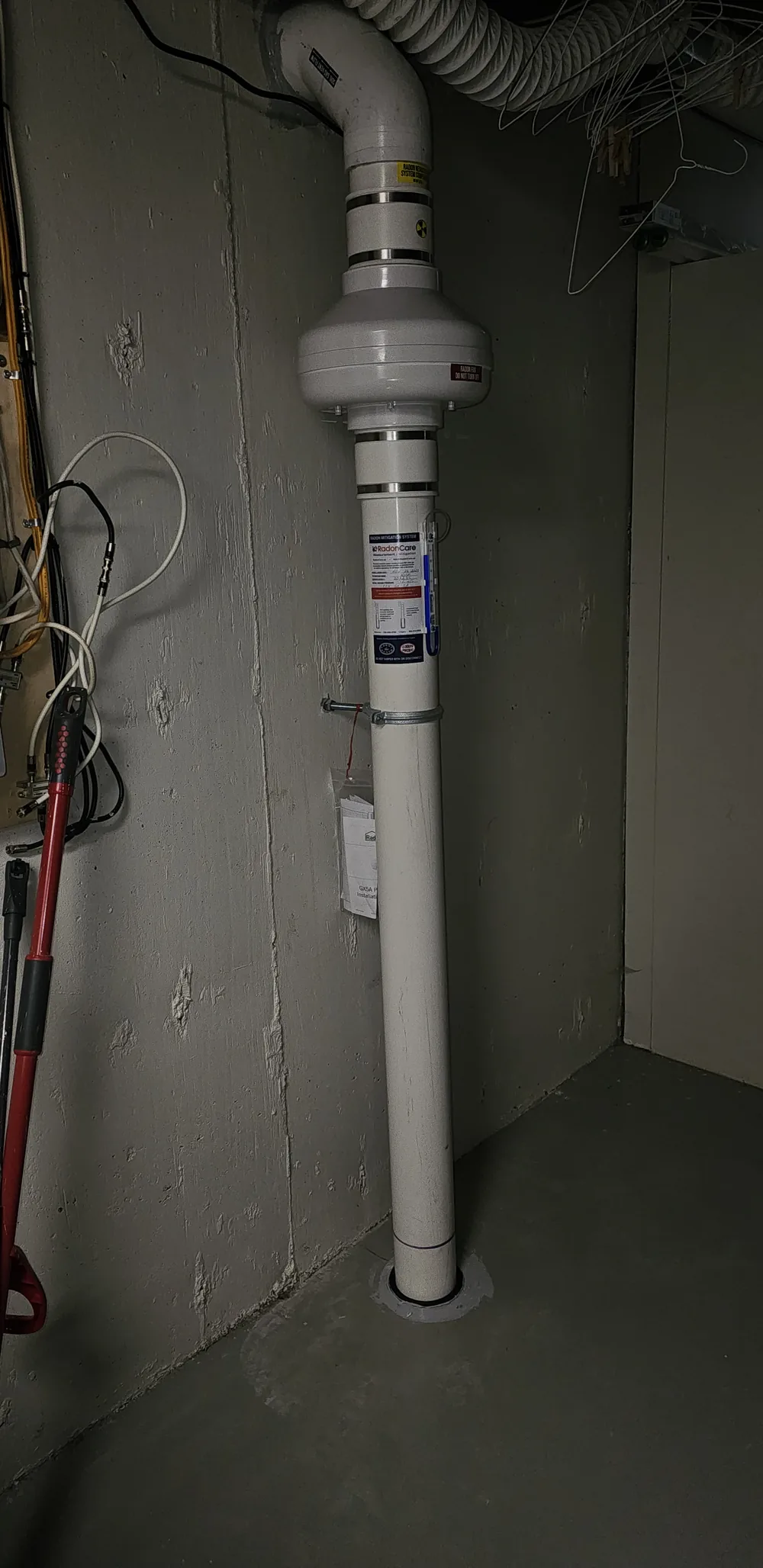 Radon Fan And Pipe Running Down To The Basement Floor In A Red Deer Bungalow
