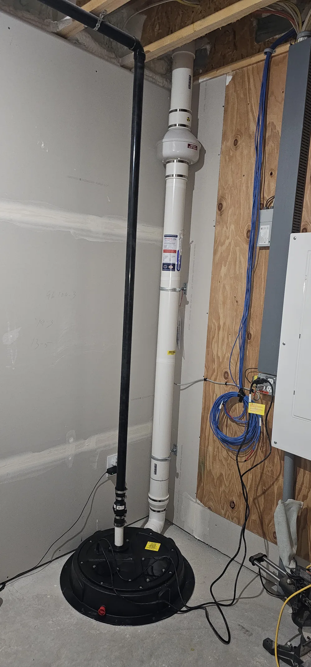 Radon Pipe Rising From A Sealed Sump Lid In A Newer Home Near Red Deer